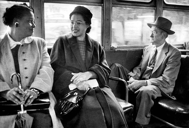  Rosa Parks riding on a bus in Alabama after a boycott ended segregation on the city's transport system