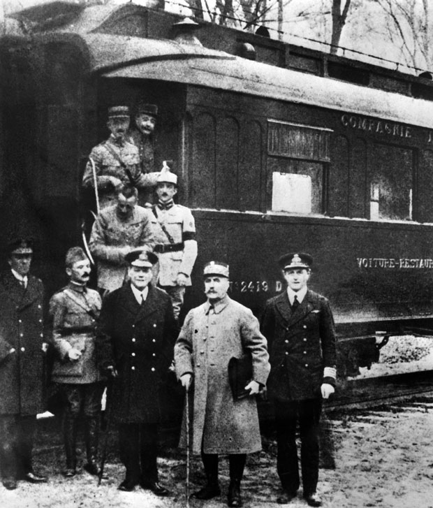  Commanders of the Allied and German forces pose by the railway carriage in which the armistice was signed