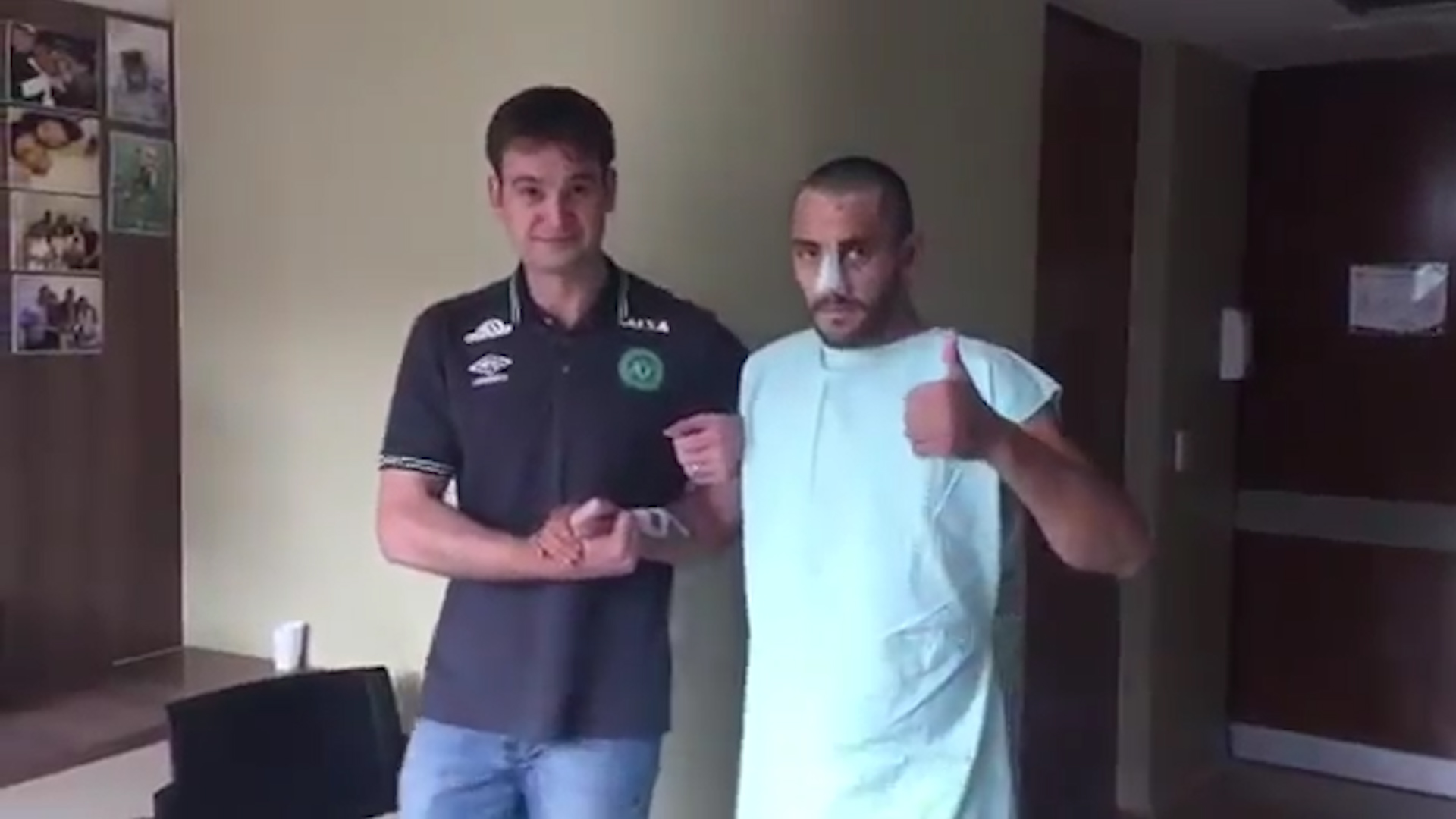  Alan Ruschel gives fans a thumbs up before after walking into hospital room