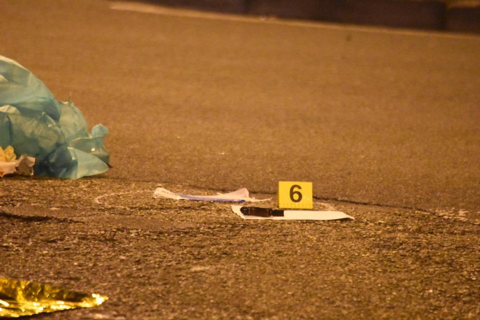  Evidence markers at the scene of the gun battle