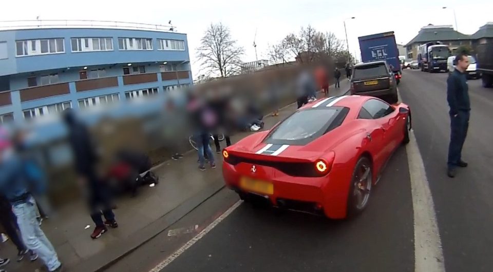  Others crowd around the luxury supercar moments after it smashed into seven youngsters while "showing off"