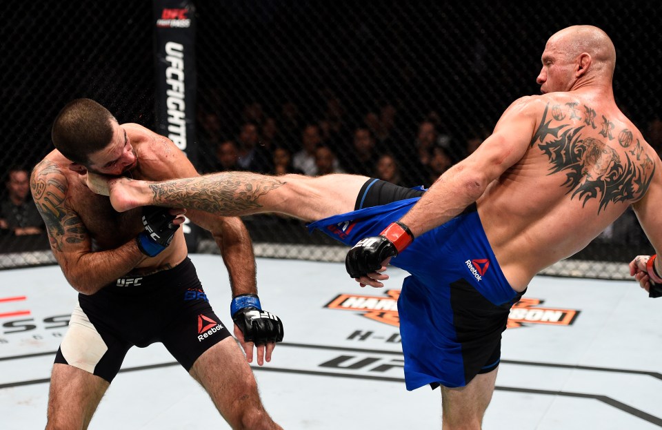  Boom, and out go the lights: Donald 'Cowboy' Cerrone lands the fight-winning head-kick on Matt Brown