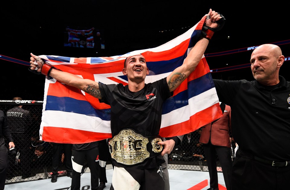  Interim champ: Max Holloway celebrates his title win in the main event