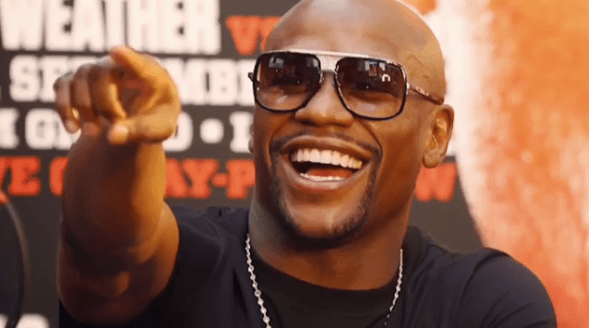  Floyd Mayweather includes a photo of himself laughing at Conor McGregor in the clip