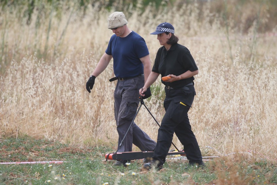  British police armed with ground scanning radar search waste land on the outskirts of Praia Da Luz