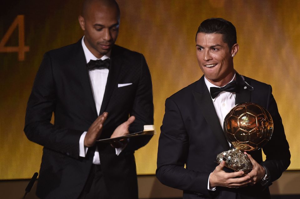  Cristiano Ronaldo receives third Ballon d'Or award from Thierry Henry in 2014