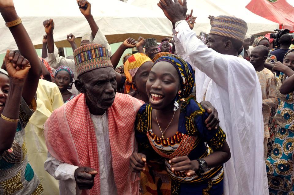  Family members celebrate after being reunited with some of the kidnapped girls