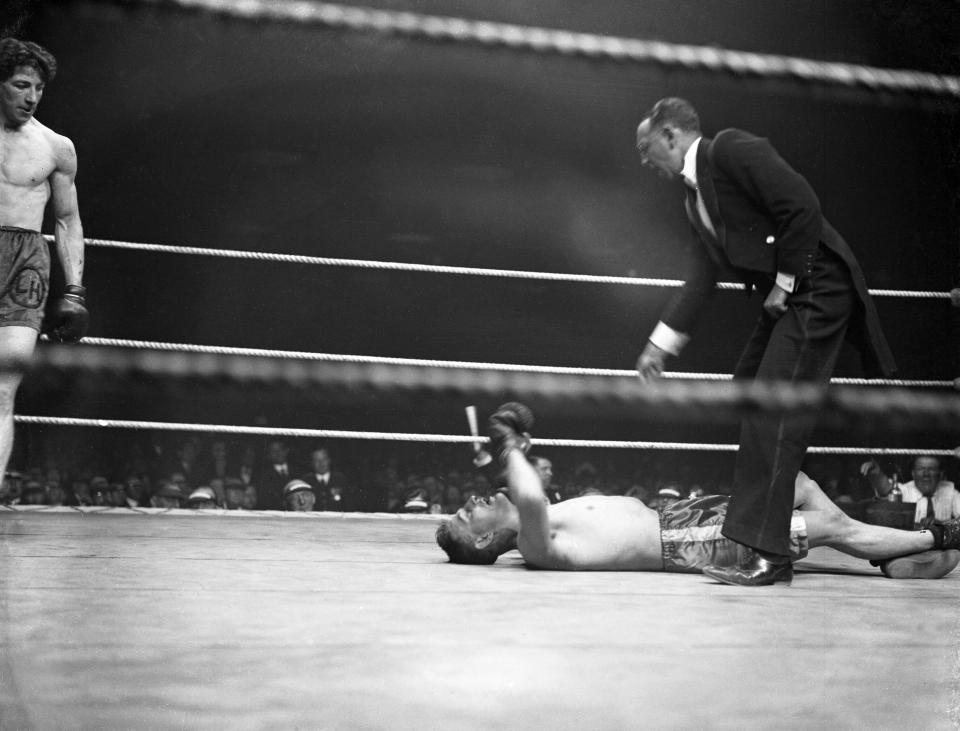  Len Harvey watches on as his opponent, Alex Ireland, is floored