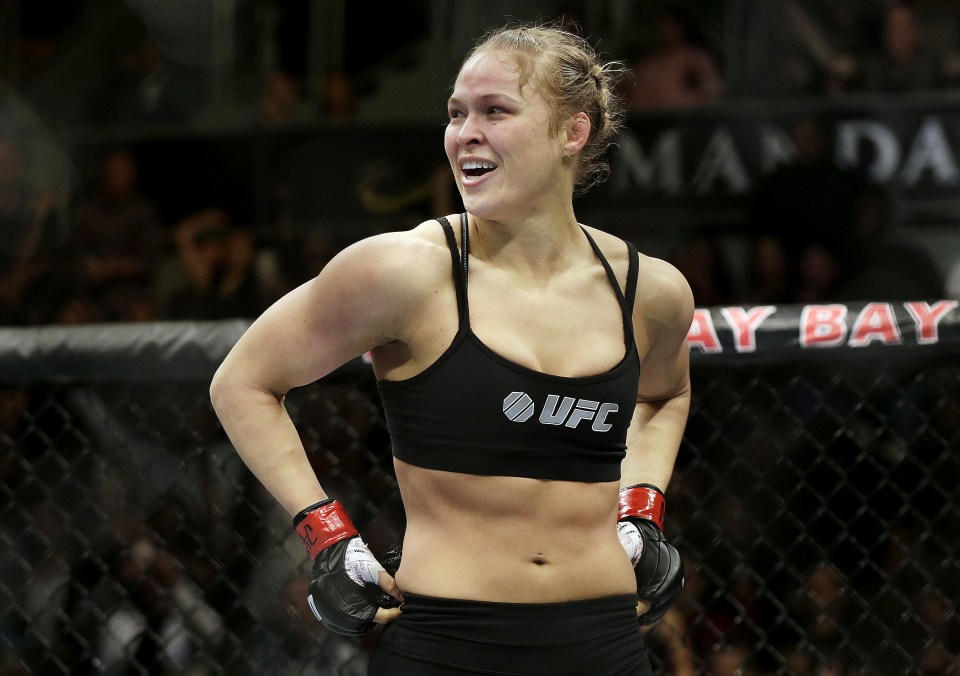  Ronda Rousey looks around after defeating Sara McMann in a UFC 170 mixed martial arts women's bantamweight title bout in Las Vegas