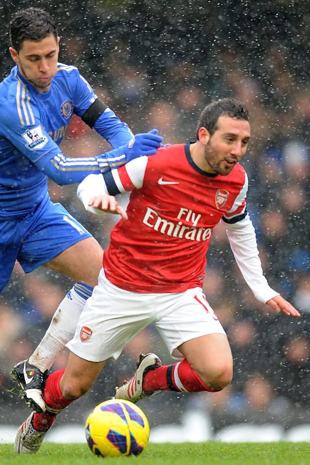  Cazorla battling it out with Chelsea's Eden Hazard