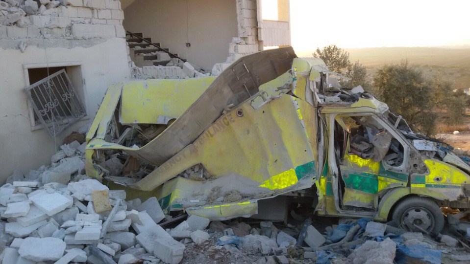  An ambulance stands destroyed after four consecutive airstrikes on a medical facility for women in Syria's northern Idlib province last month