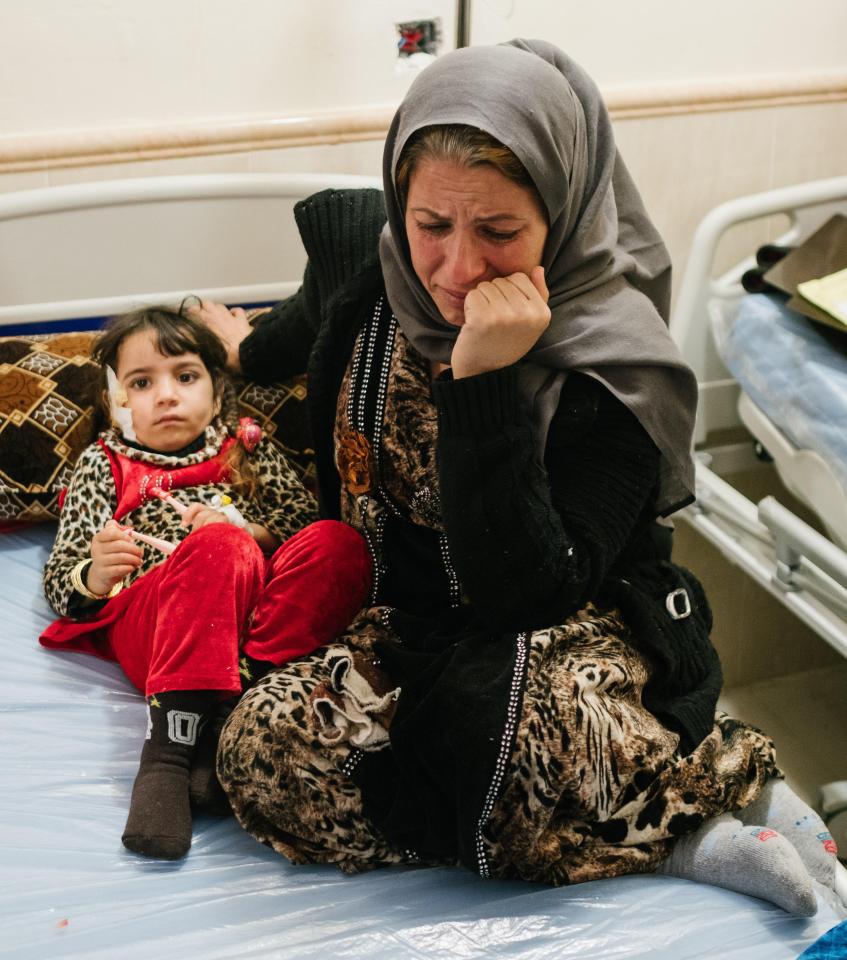  Samar Ramazan with her daughter Norhan Nashwan , 5 who has a fragment of shrapnel lodged inside her skull