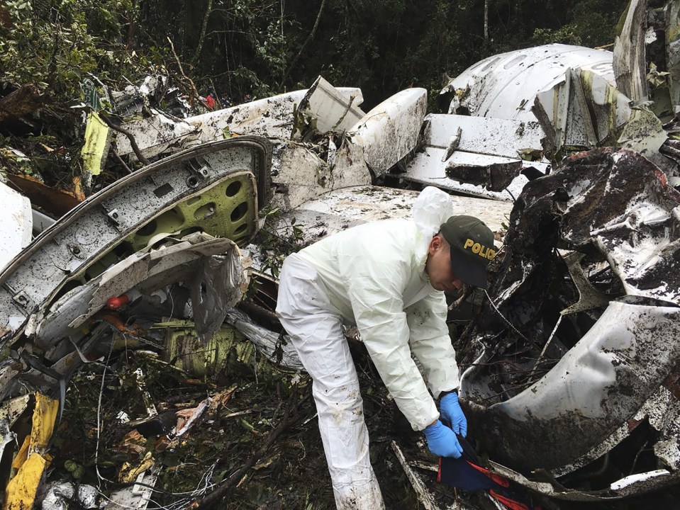  Air crash investigators have been examining the scene of the crash