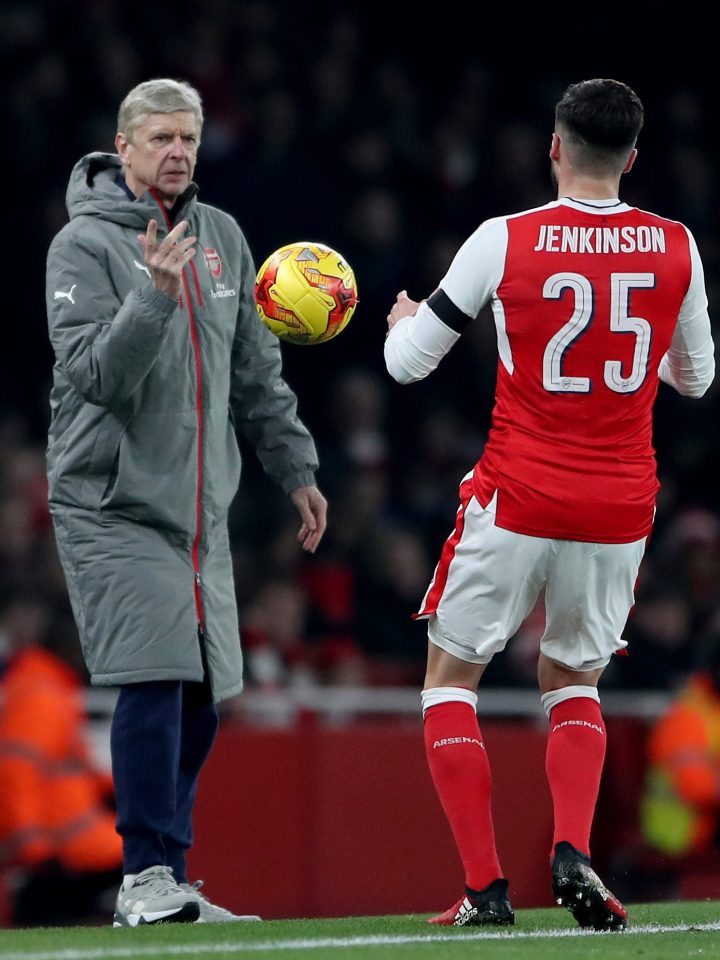  Arsene Wenger throws the ball to Arsenal defender Carl Jenkinson during the EFL Cup exit at The Emirates