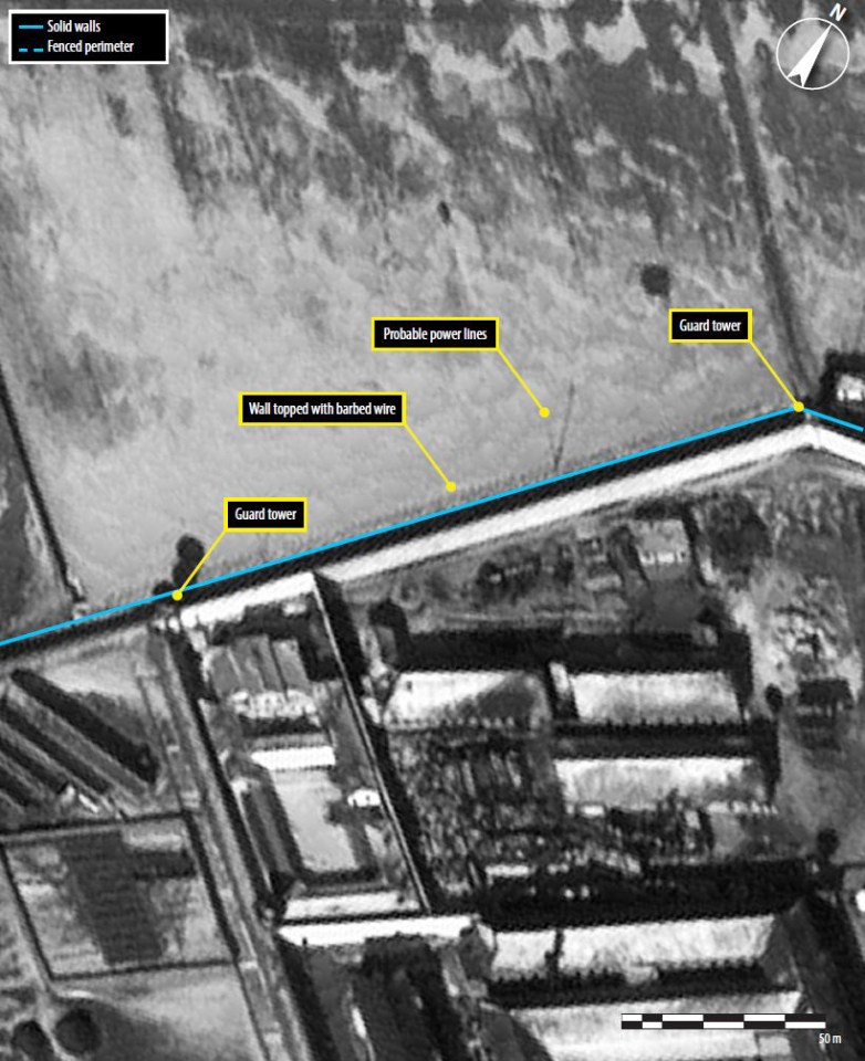  One of several North Korean prison camps. This satellite image shows a prisoner housing block, guard tower, probable power lines and a wall topped with barbed wire