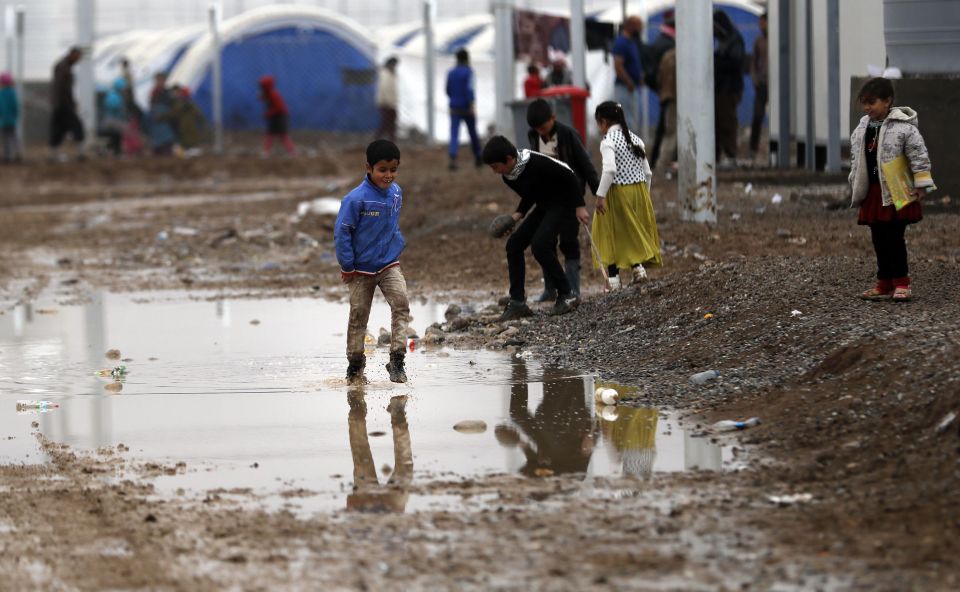  A group of children embraced the situation and played in the biggest pool of muddy water