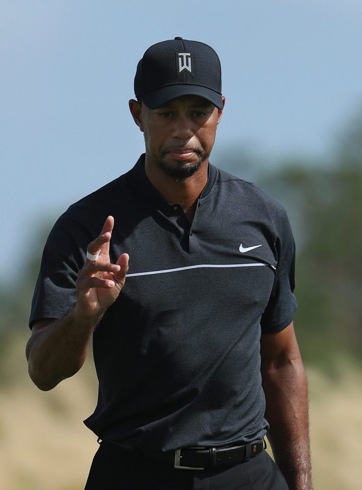 Tiger Woods moved into an early share of the lead