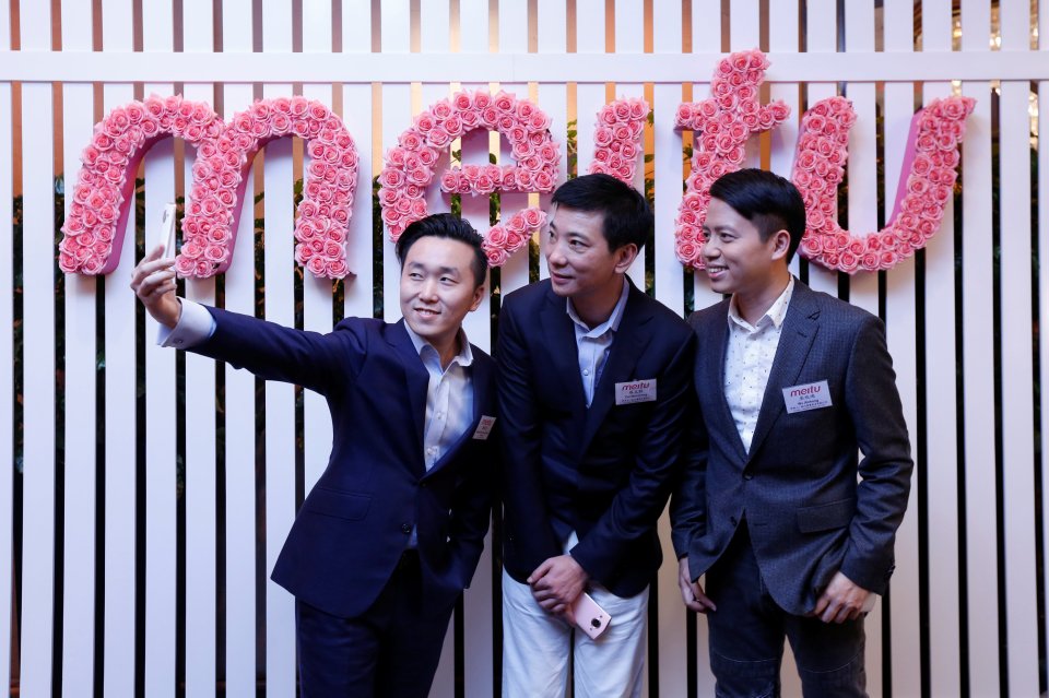  Meitu CFO Gary Ngan, Founder and Chairman Cai Wensheng, and founder and CEO Wu Xinhong pose for a photo