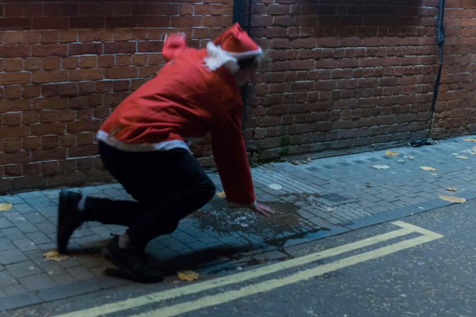 This student took a tumble after vomiting on the street during last night's massive pub crawl 