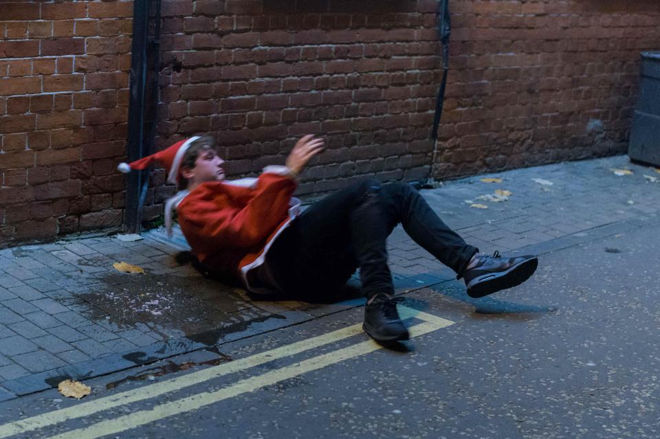 He collapsed in the suspicious looking puddle of liquid still wearing his Santa cloak and hat 