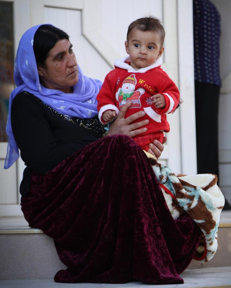  Festive Firas looks snug in his snowman jumper ... But more kids like him need your help