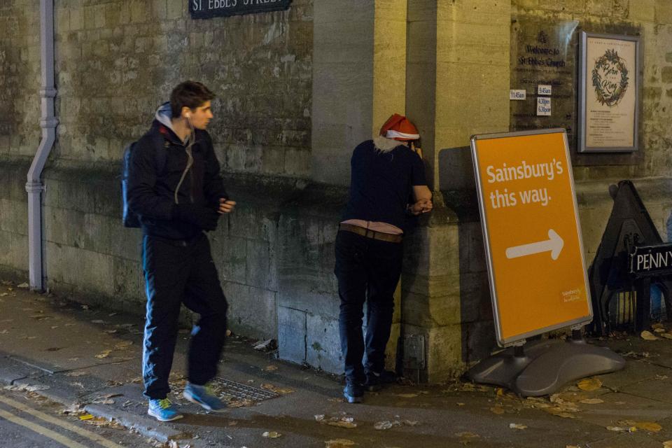 This student didn't appear to fancy food though as he vomited against one of Oxford's historic buildings