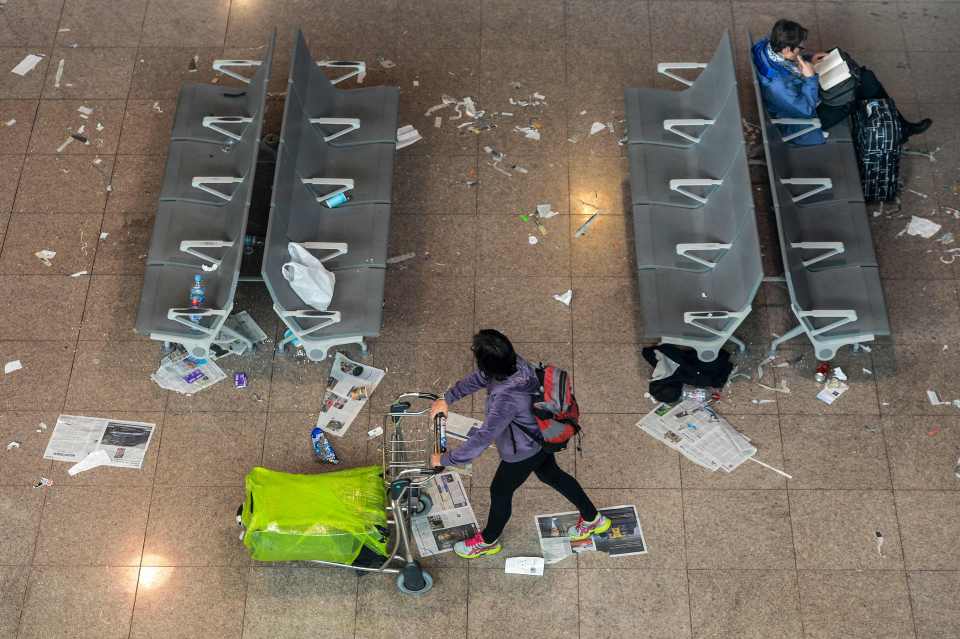  Pictures show discarded rubbish strewn across all surfaces of the airport