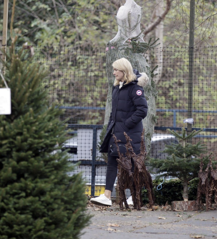  Holly kept out the cold by wearing a long winter coat