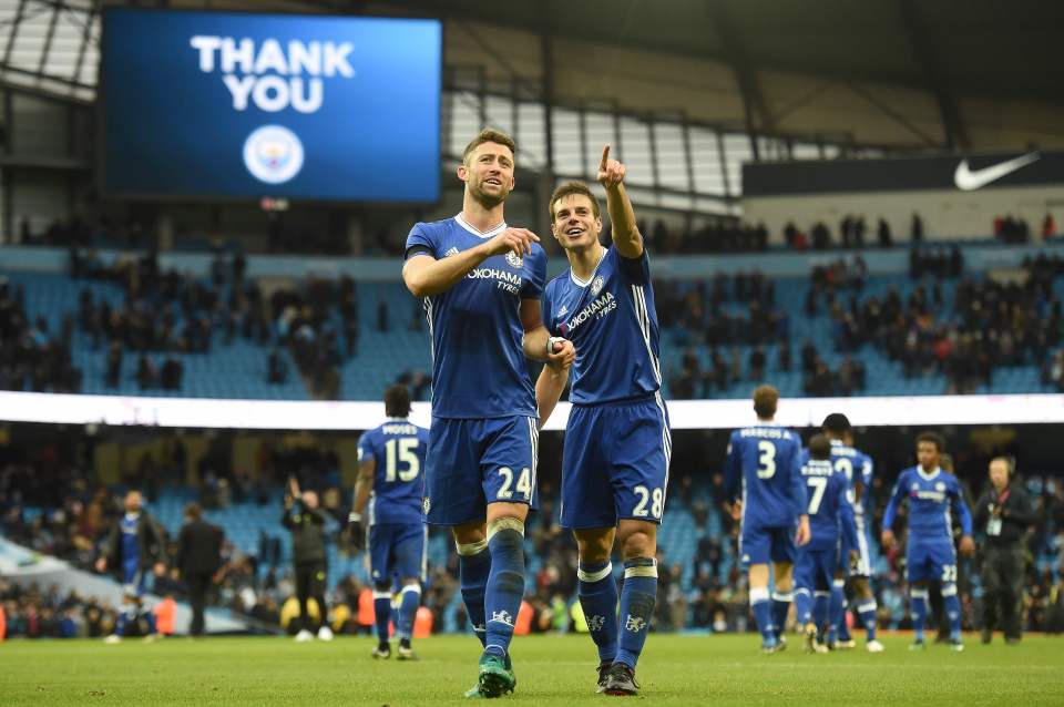  Cesar Azpilicueta and Gary Cahill celebrate following the Premier League match with Manchester City