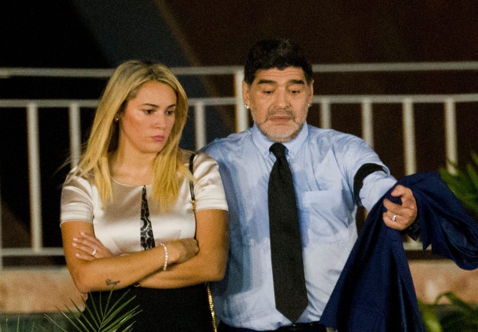  Argentina's soccer legend Diego Armando Maradona and his partner Rocio Oliva arrive to the stage for a rally honoring deceased Cuban leader Fidel Castro