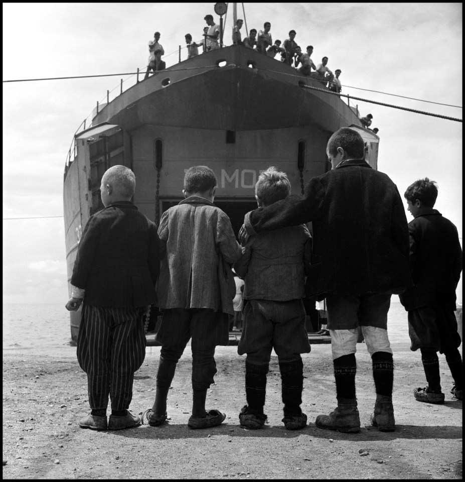  Five boys from Promahi, Greece, in front of the refugee ship S.S Samos that evacuated children during the Civil War in 1948