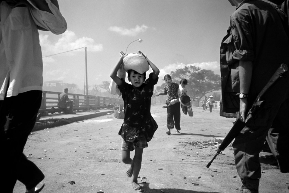  This harrowing image from the battle for Saigon shows refugees under fire in 1968