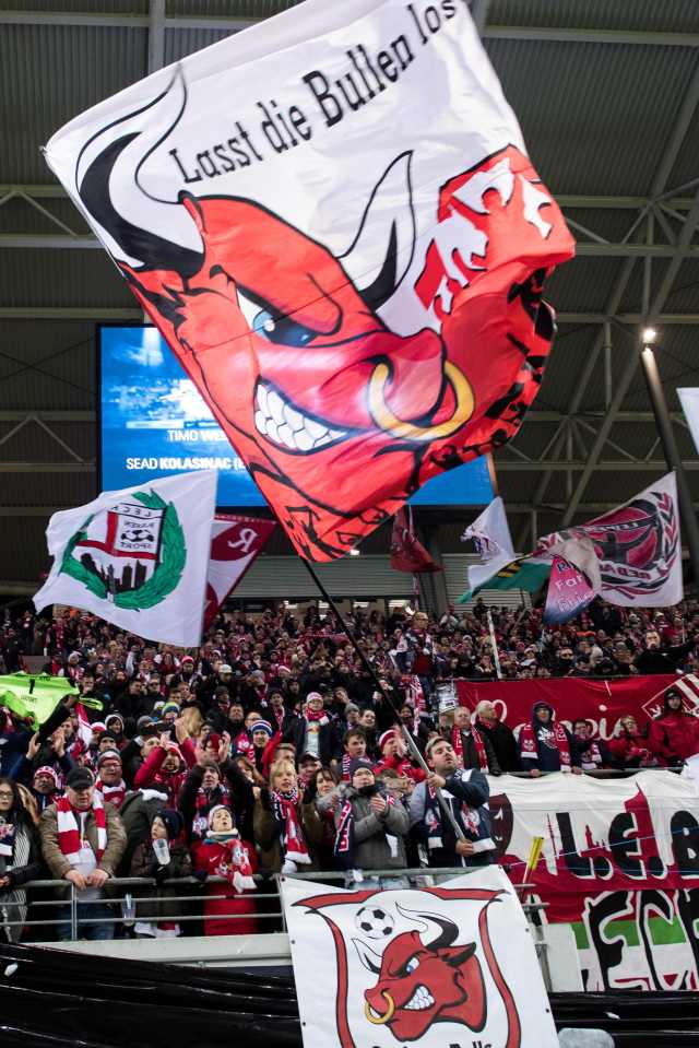 RB Leipzig fans cheer during the German first division Bundesliga football match between RB Leipzig and Schalke 04 in Leipzig, eastern Germany on December 3, 2016. / AFP PHOTO / JENS SCHLUTER / RESTRICTIONS: DURING MATCH TIME: DFL RULES TO LIMIT THE ONLINE USAGE TO 15 PICTURES PER MATCH AND FORBID IMAGE SEQUENCES TO SIMULATE VIDEO. == RESTRICTED TO EDITORIAL USE == FOR FURTHER QUERIES PLEASE CONTACT DFL DIRECTLY AT + 49 69 650050 / RESTRICTIONS: DURING MATCH TIME: DFL RULES TO LIMIT THE ONLINE USAGE TO 15 PICTURES PER MATCH AND FORBID IMAGE SEQUENCES TO SIMULATE VIDEO. == RESTRICTED TO EDITORIAL USE == FOR FURTHER QUERIES PLEASE CONTACT DFL DIRECTLY AT + 49 69 650050JENS SCHLUTER/AFP/Getty Images