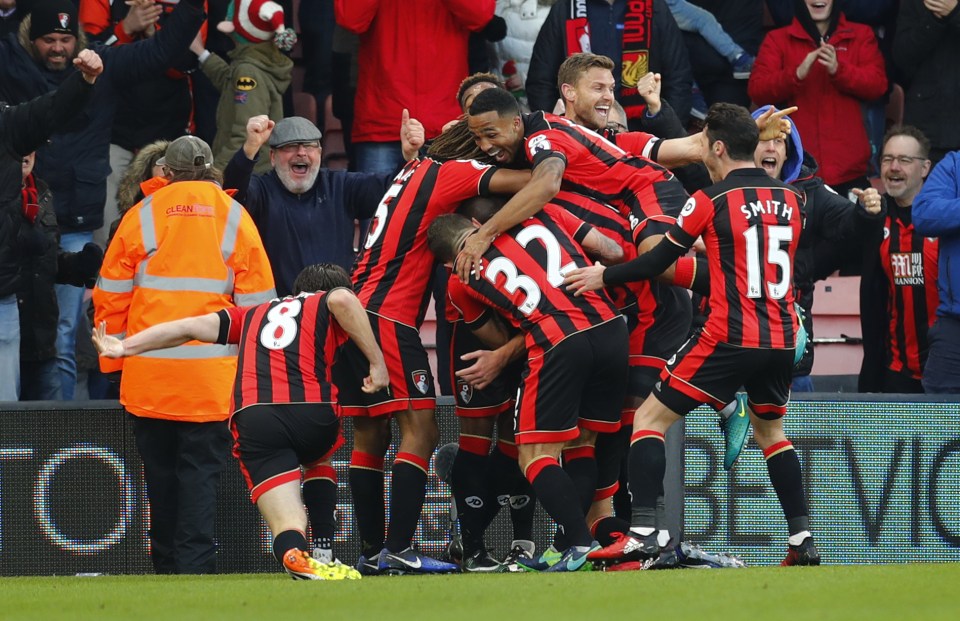  The Bournemouth players are in ecstasy after securing a superb 4-3 victory against Liverpool