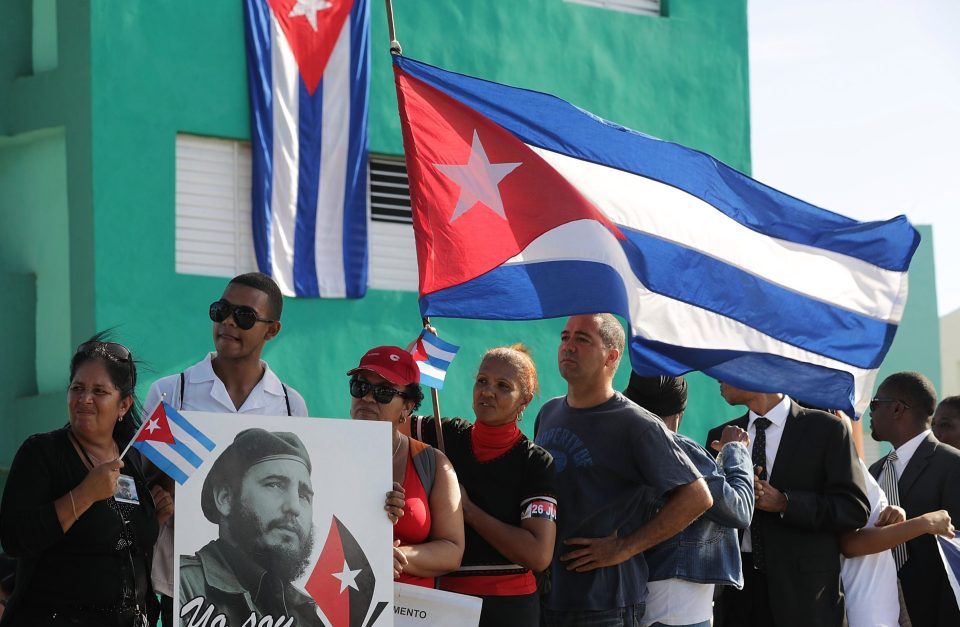  People wait outside the Cementerio Santa Ifigenia hoping to enter and see where the remains of former Cuban President Fidel Castro was entombed