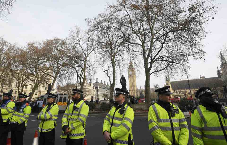  Police stand guard outside the court