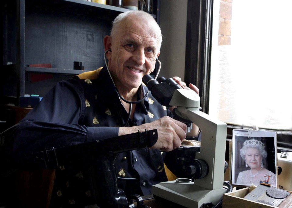  Micro-engraver Grahan Short wears a stethoscope at his desk - working between heartbeats