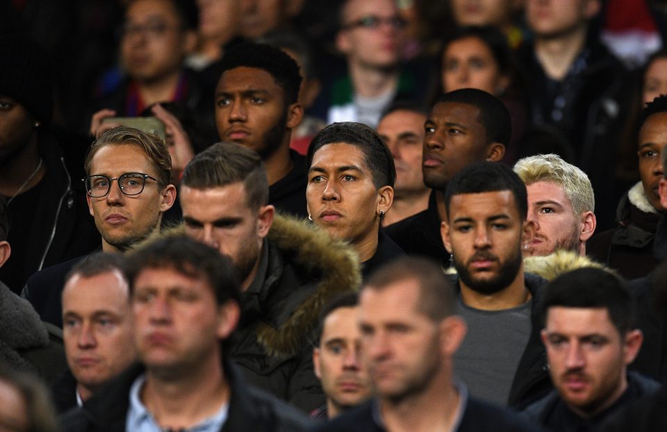  Lucas Leiva and Roberto Firmino looks on from the stands