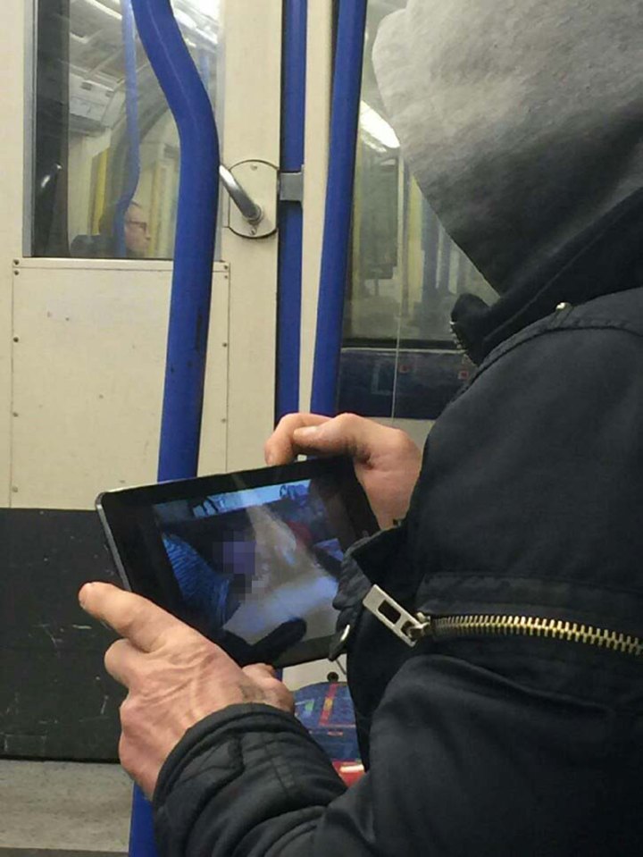  Perv was snapped watching x-rated footage on rush-hour tube service earlier this week