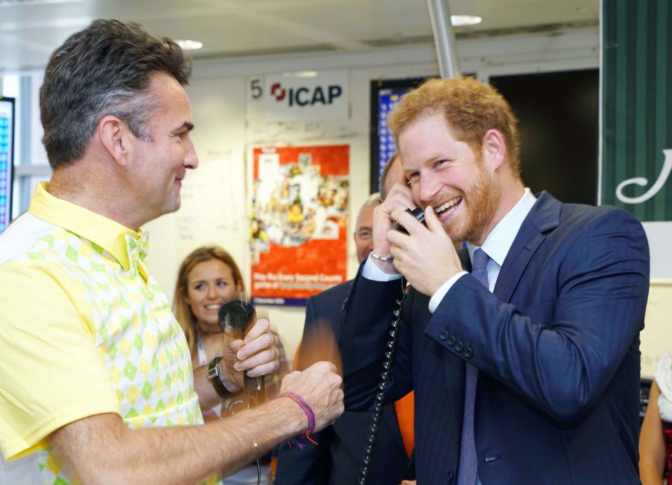  Prince Harry laughed and joked on the phone as he made deals for charity at ICAP