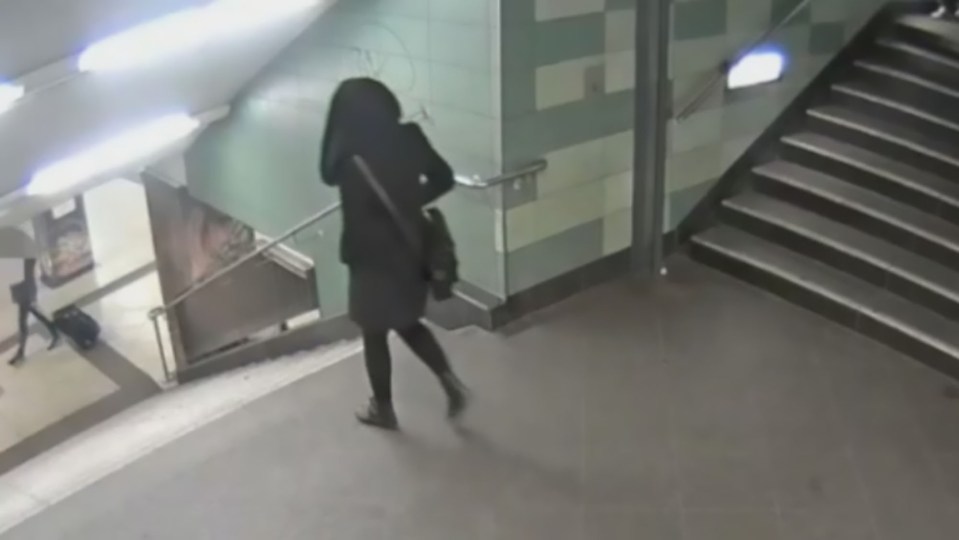  CCTV shows a woman walking alone through a metro station in Berlin