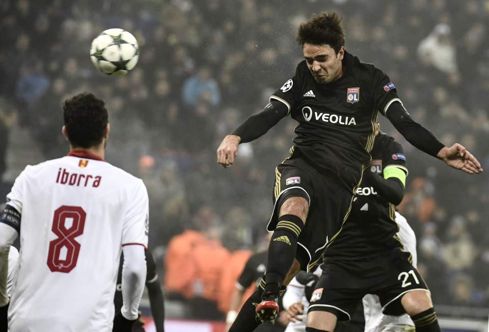 Lyon's French midfielder Clement Grenier heads the ball during the UEFA Champions League Group H match