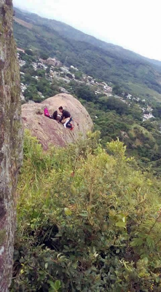  The girl is seen with her trousers off while her partner kneels between her thighs