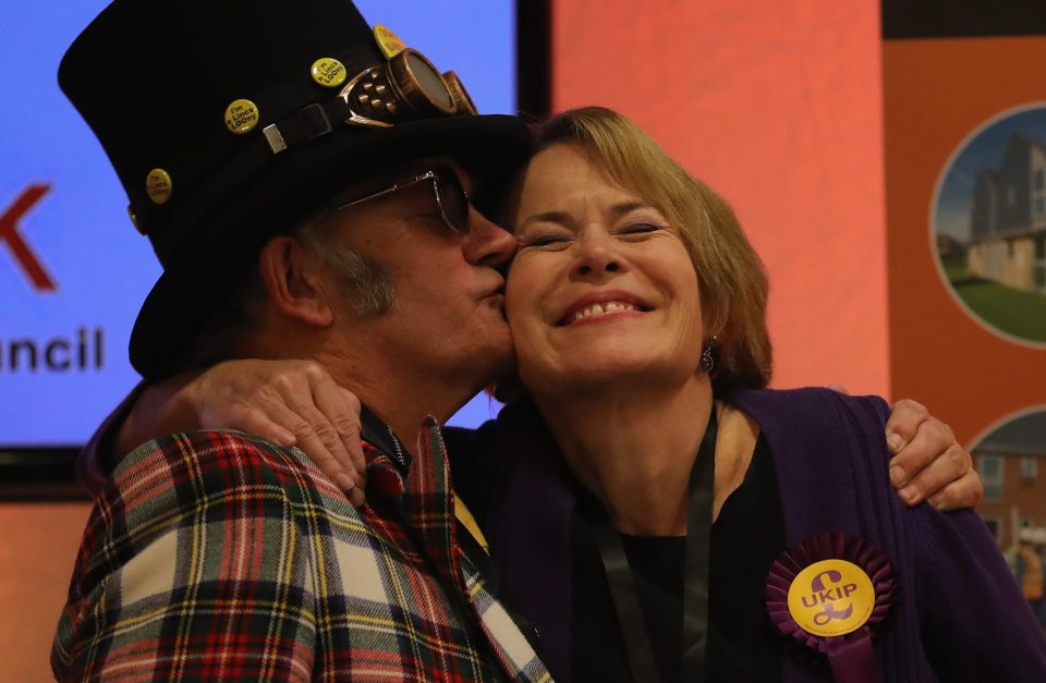  UKIP candidate Victoria Ayling is embraced by the Monster Raving Loony Party candidate, The Iconic Arty-Pole