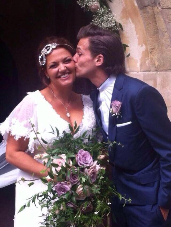 Louis pictured with his mum at her wedding to Dan Deakin in 2015