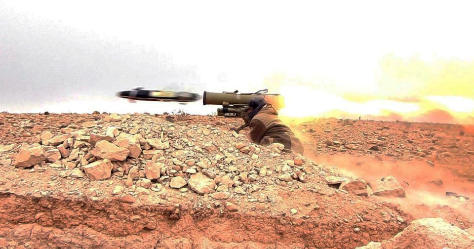  A gunman fires an anti-tank missile at Syrian troops in the attack, which left them fleeing via the south of the city