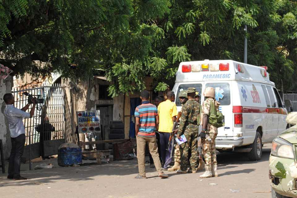  Emergency services and soldiers gather at the scene of a suicide bomb attack