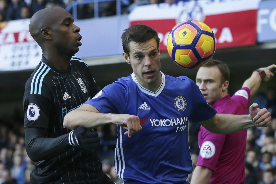  Chelsea's Cesar Azpilicueta, right, competes for the ball with West Bromwich Albion's Allan-Romeo Nyom