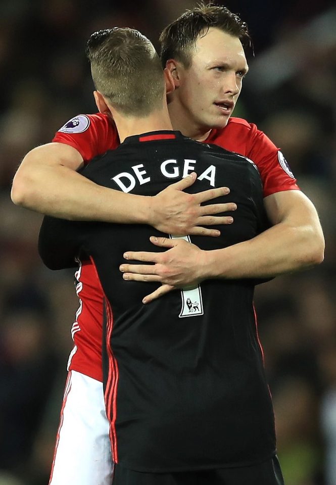  Jones gets a 'well done' hug from David de Gea