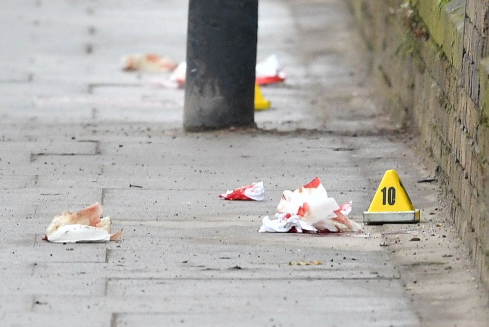  Blood-covered items are pictured at the scene in south-west London